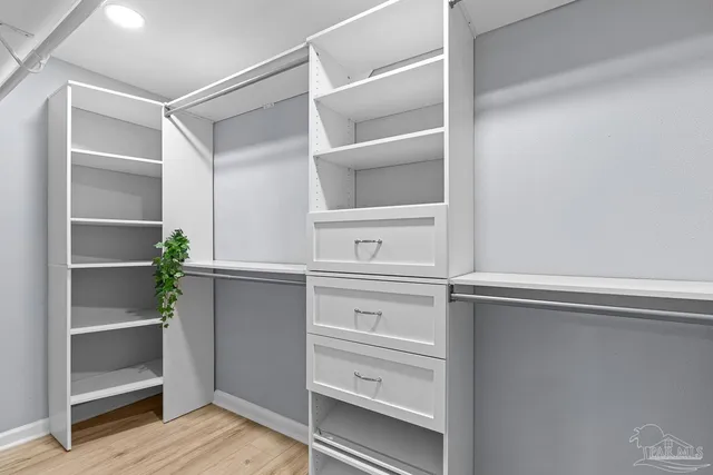 a view of an empty walk in closet