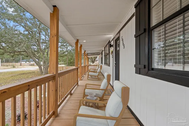 a view of balcony with furniture