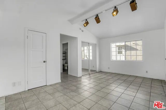 a view of living room with furniture and window