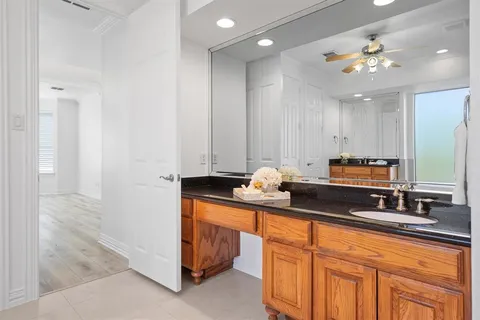 a kitchen with a refrigerator and cabinets