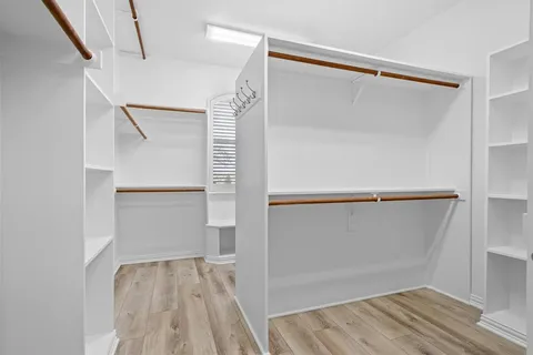 a bedroom with bed and a window