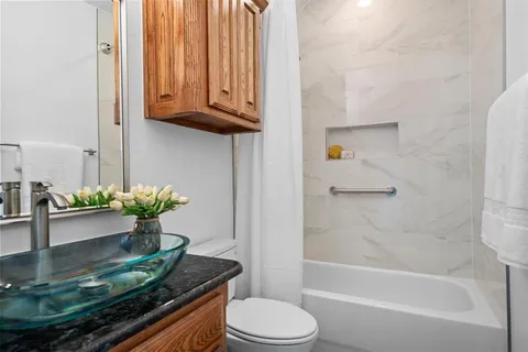 a bedroom with a bed a couch and a couch