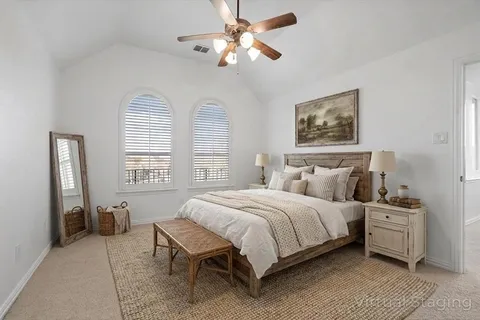 a bedroom with a bed and a potted plant