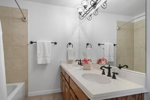 a living room with furniture a flat screen tv and a large window