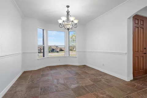 a large kitchen with stainless steel appliances granite countertop a stove a sink and a refrigerator