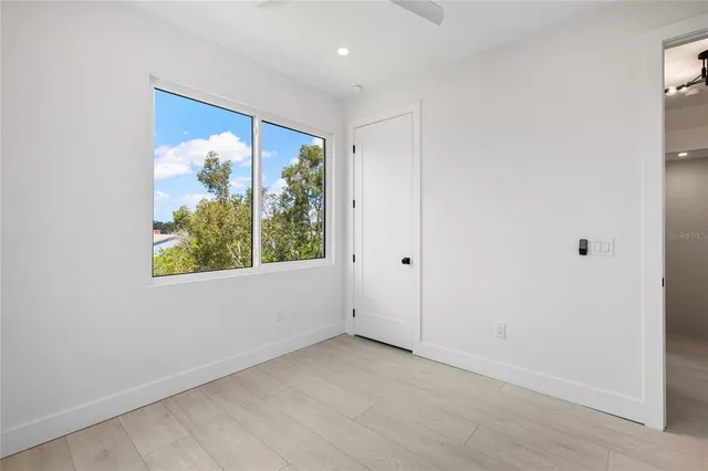 a kitchen with a table and chairs