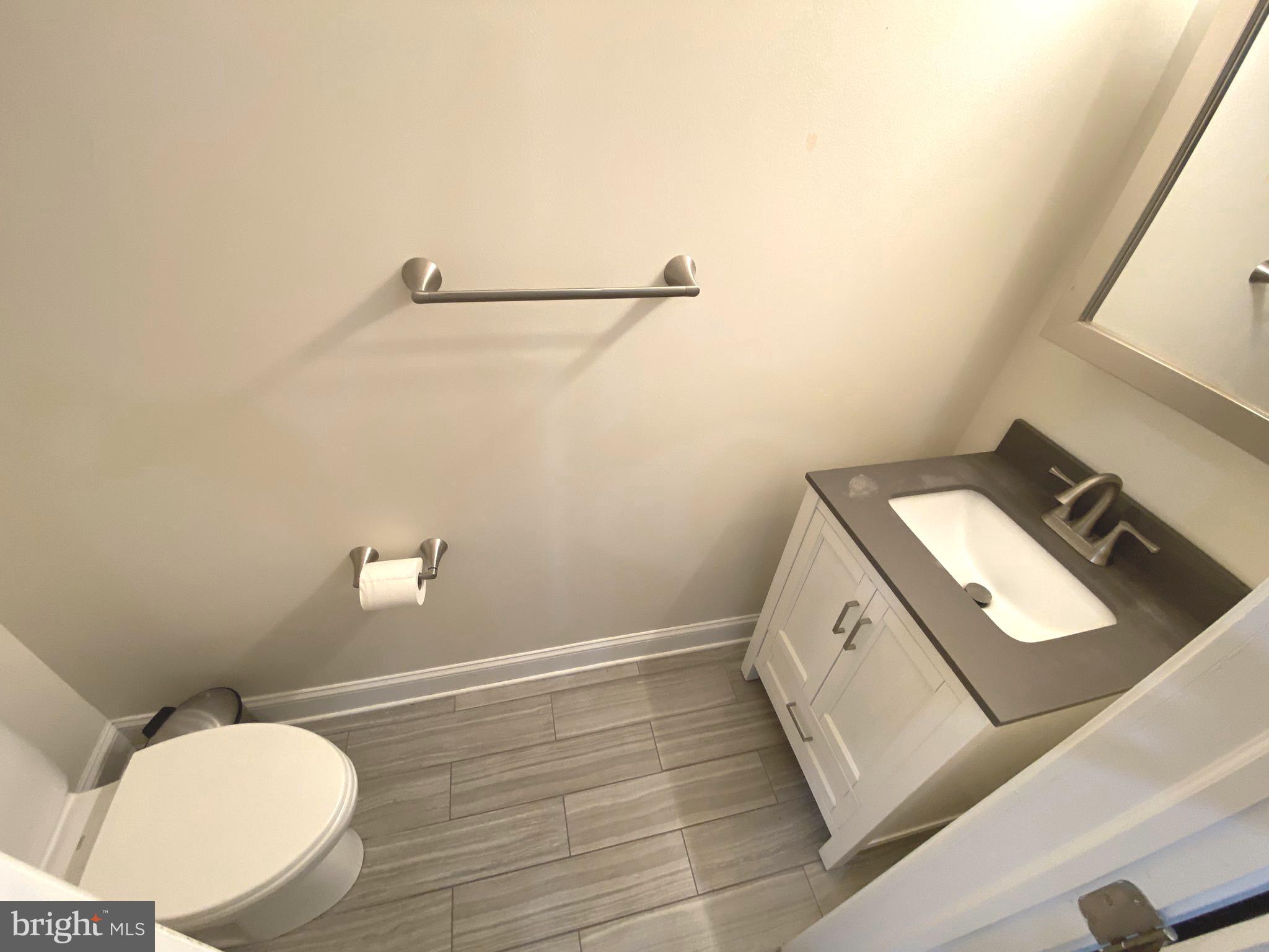 75 New York Avenue Northwest Washington, DC 20001 - Photo 18 of 32 a bathroom with a sink mirror and toilet