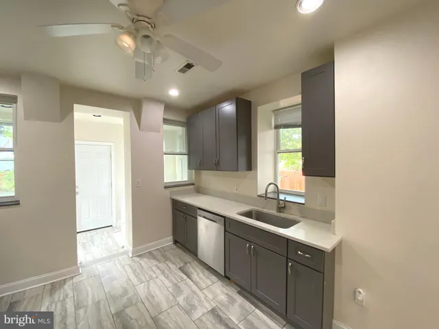 a bathroom with a sink double vanity and a mirror