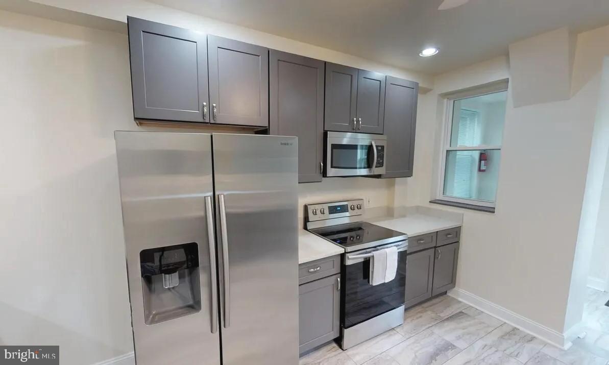 75 New York Avenue Northwest Washington, DC 20001 - Photo 22 of 32 a kitchen with stainless steel appliances granite countertop a refrigerator stove and microwave