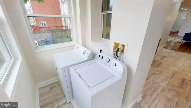 a utility room with dryer and washer