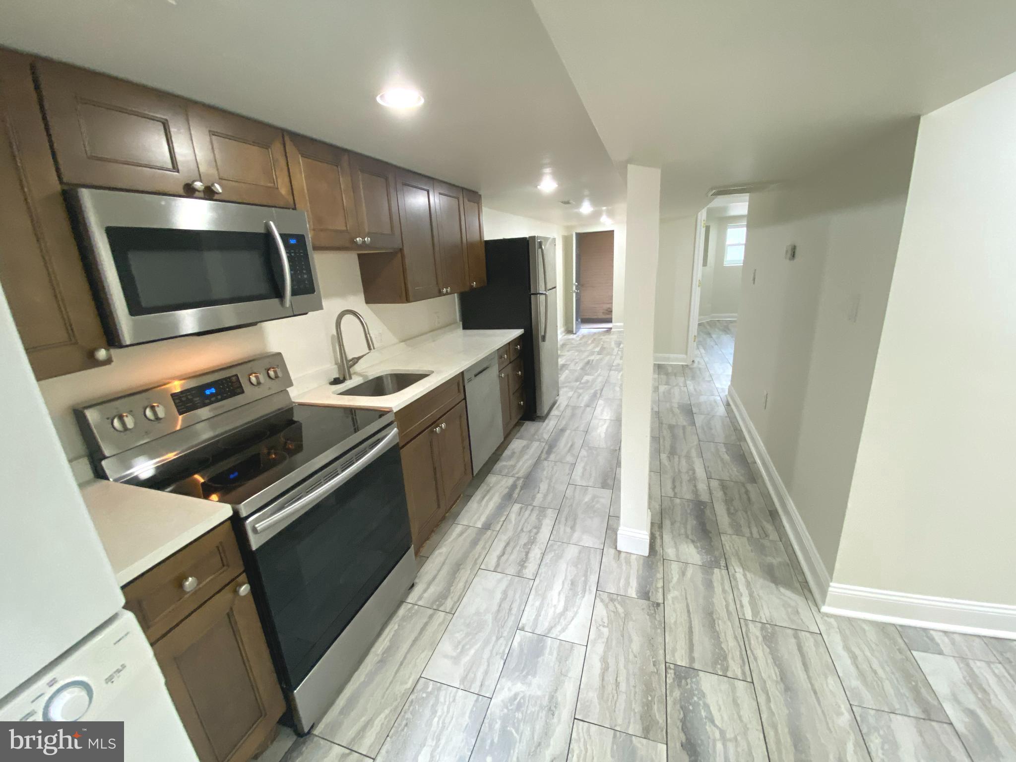 75 New York Avenue Northwest Washington, DC 20001 - Photo 26 of 32 a large kitchen with stainless steel appliances