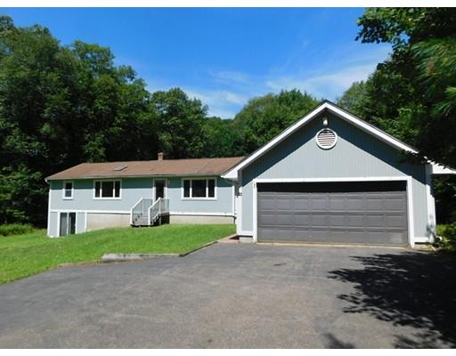 33 Bay Path Road Charlton, MA 01507 - Photo 1 of 19 a front view of a house with a yard and garage