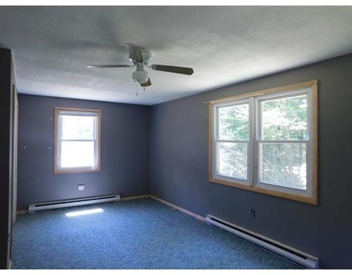 33 Bay Path Road Charlton, MA 01507 - Photo 12 of 19 an empty room with windows and ceiling fan