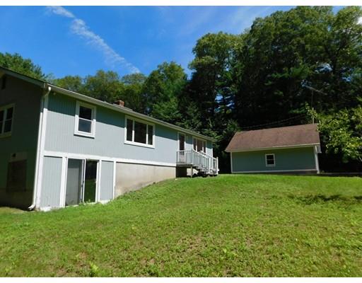 33 Bay Path Road Charlton, MA 01507 - Photo 2 of 19 a front view of a house with a yard