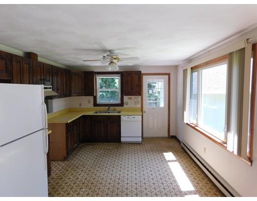 33 Bay Path Road Charlton, MA 01507 - Photo 3 of 19 a large kitchen with a large window and refrigerator
