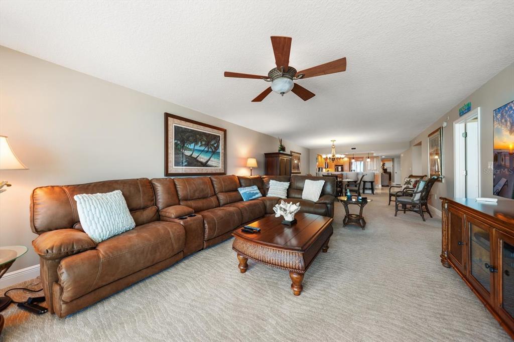16326 Gulf Boulevard, Unit 206 Redington Beach, FL 33708 - Photo 11 of 42 a living room with furniture and a large window