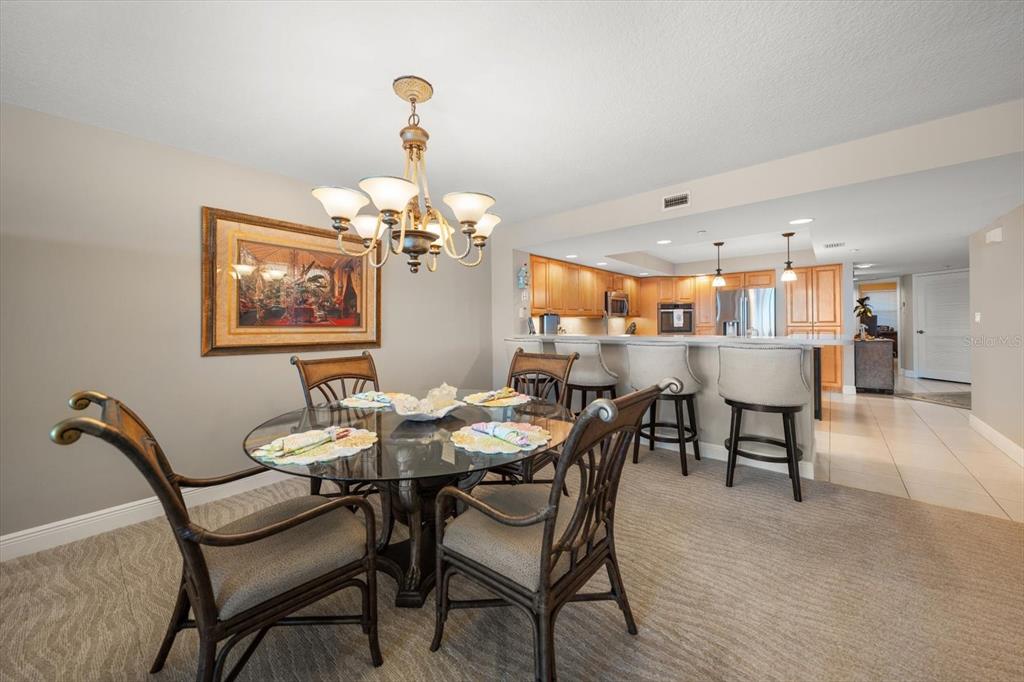 16326 Gulf Boulevard, Unit 206 Redington Beach, FL 33708 - Photo 13 of 42 a dining room with furniture and window