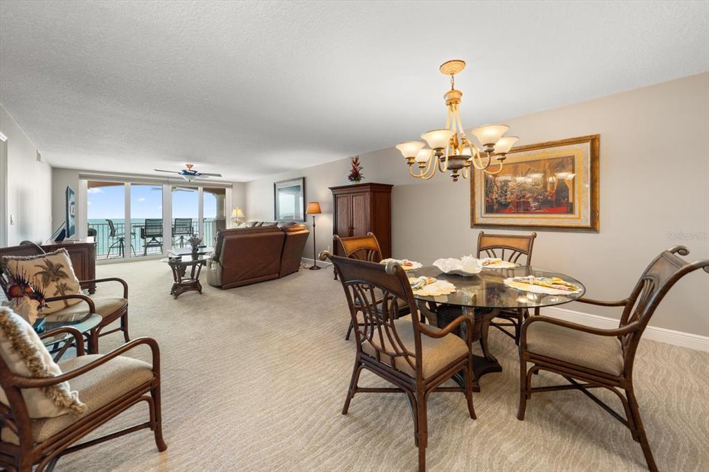 16326 Gulf Boulevard, Unit 206 Redington Beach, FL 33708 - Photo 14 of 42 a view of a dining room with furniture and chandelier