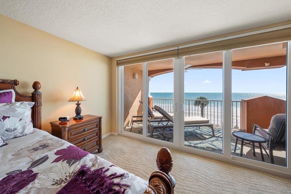16326 Gulf Boulevard, Unit 206 Redington Beach, FL 33708 - Photo 20 of 42 a bedroom with furniture and a large window