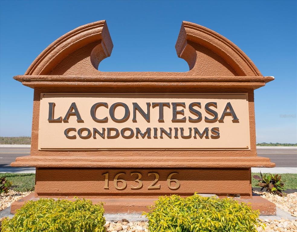 16326 Gulf Boulevard, Unit 206 Redington Beach, FL 33708 - Photo 2 of 42 a close up of a street sign