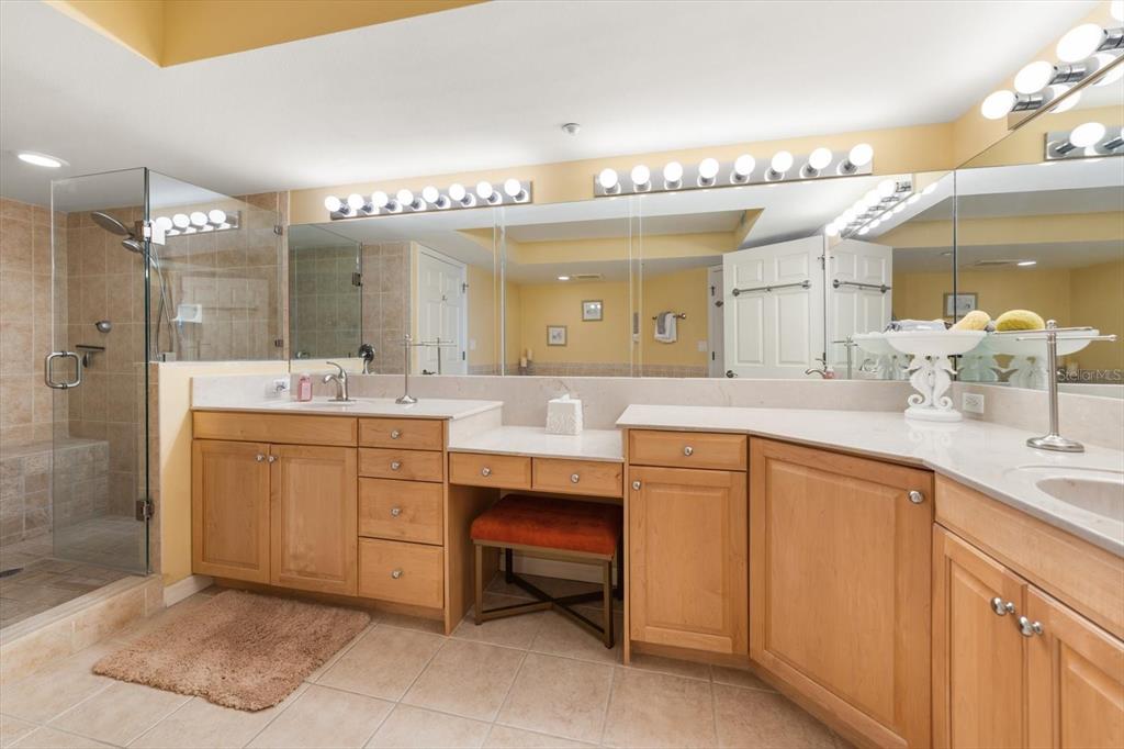16326 Gulf Boulevard, Unit 206 Redington Beach, FL 33708 - Photo 24 of 42 a bathroom with a sink vanity and mirror
