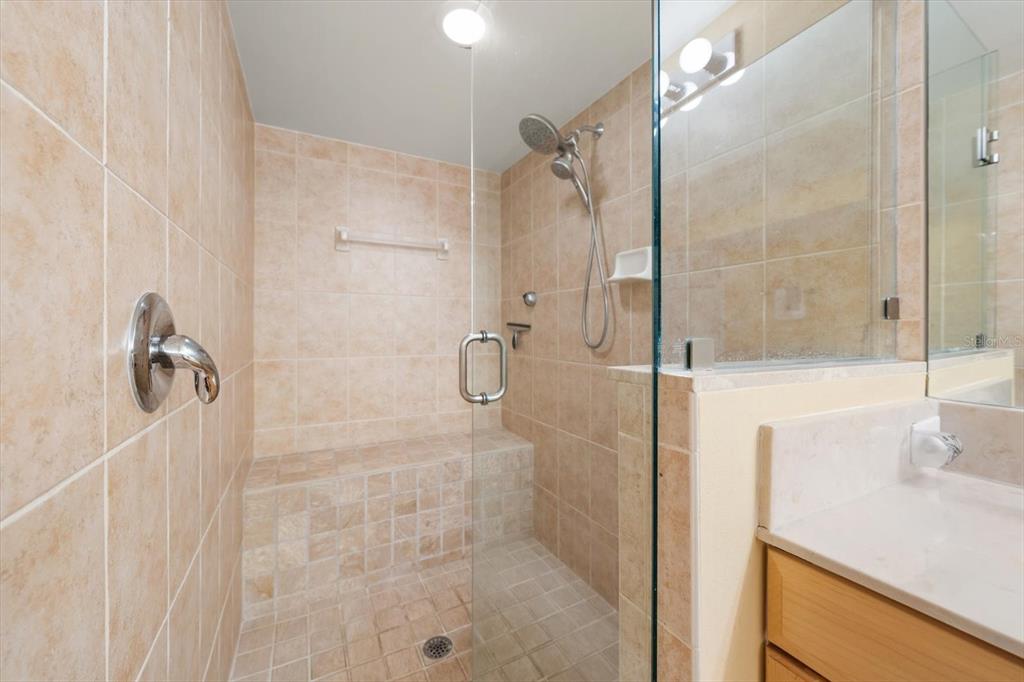 16326 Gulf Boulevard, Unit 206 Redington Beach, FL 33708 - Photo 25 of 42 a bathroom with a shower and a sink