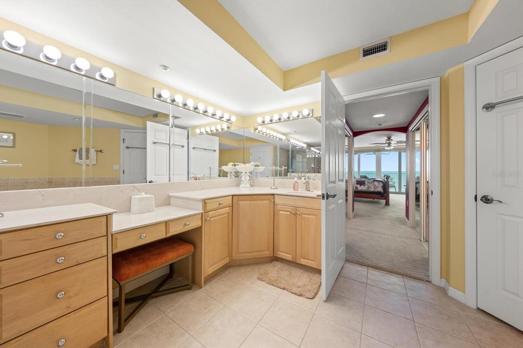 16326 Gulf Boulevard, Unit 206 Redington Beach, FL 33708 - Photo 26 of 42 a bathroom with a sink a vanity and a mirror