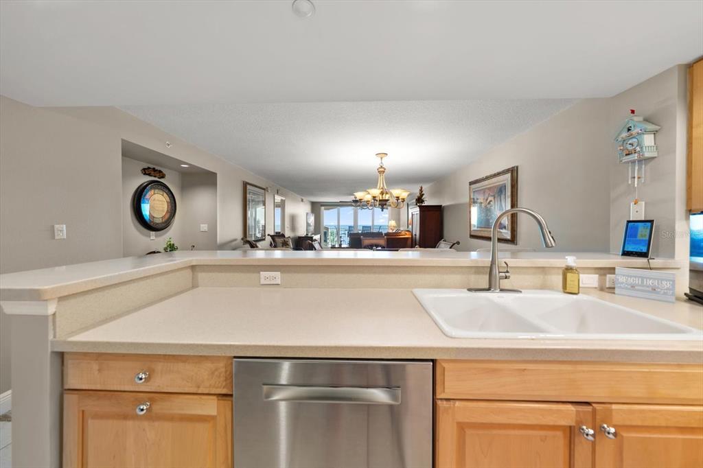 16326 Gulf Boulevard, Unit 206 Redington Beach, FL 33708 - Photo 27 of 42 a kitchen with a sink and a mirror