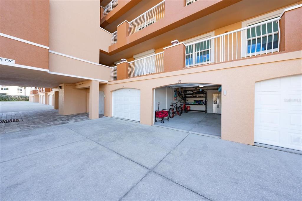 16326 Gulf Boulevard, Unit 206 Redington Beach, FL 33708 - Photo 36 of 42 front view of a building with a bench