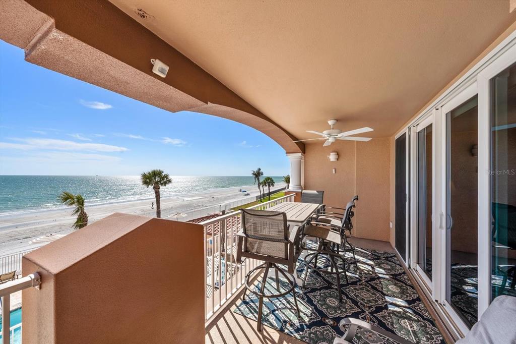 16326 Gulf Boulevard, Unit 206 Redington Beach, FL 33708 - Photo 5 of 42 a dinning table and chairs in a balcony
