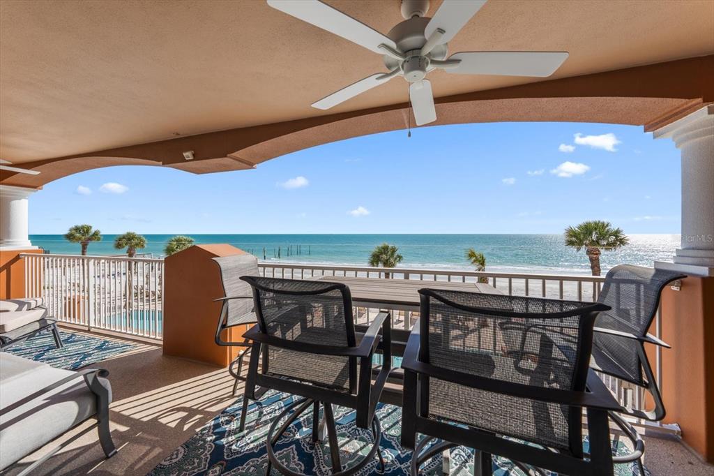 16326 Gulf Boulevard, Unit 206 Redington Beach, FL 33708 - Photo 8 of 42 a view of a chairs and table in patio