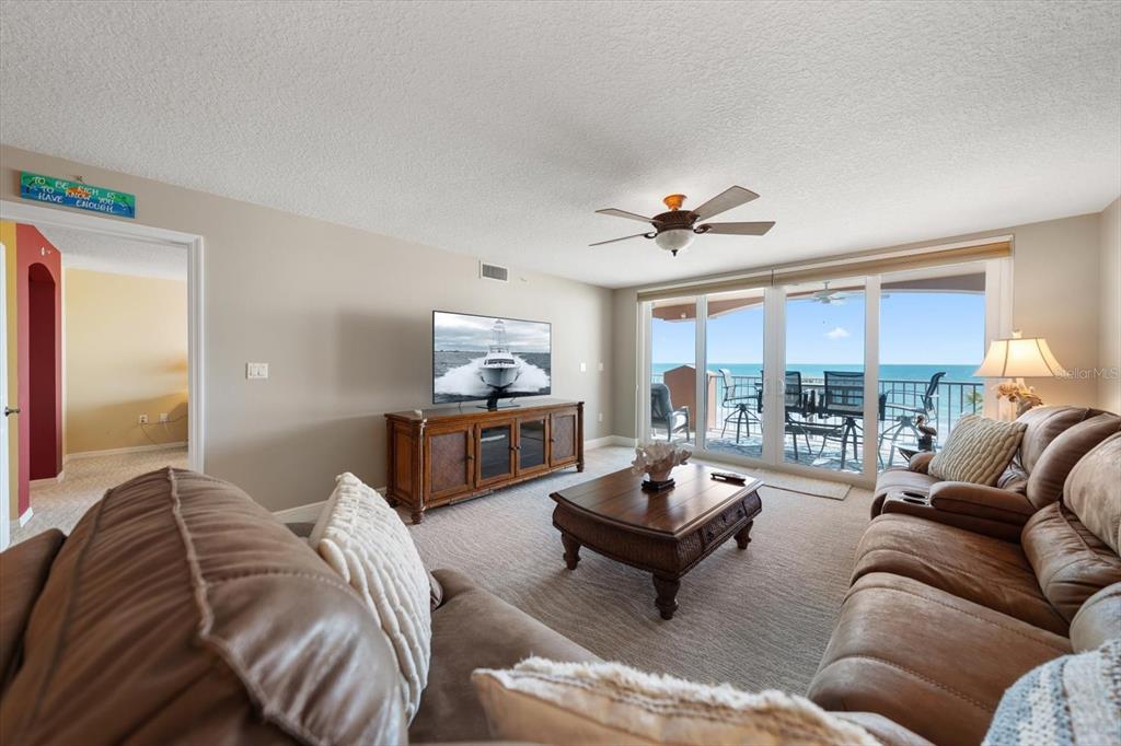 16326 Gulf Boulevard, Unit 206 Redington Beach, FL 33708 - Photo 9 of 42 a living room with furniture and a large window