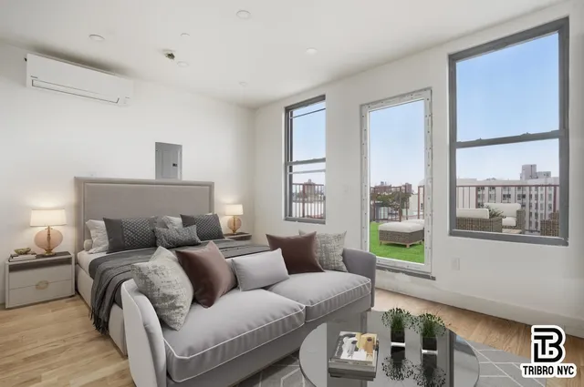 a living room with furniture and a large window