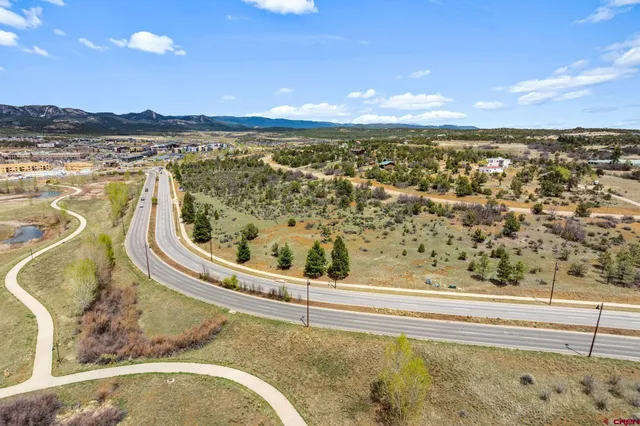 a view of a swimming pool and an outdoor seating