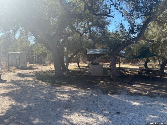 254 Jolie Drive Spring Branch, TX 78070 - Photo 2 of 16 a view of a street with lots of green space and trees