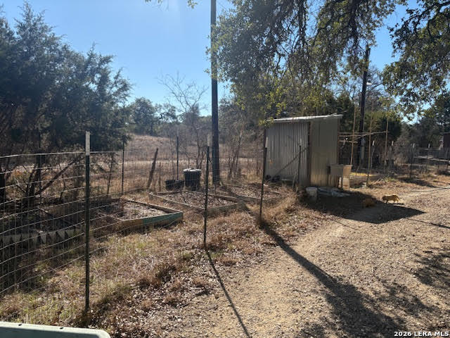 254 Jolie Drive Spring Branch, TX 78070 - Photo 5 of 16 a backyard of a house with lots of green space