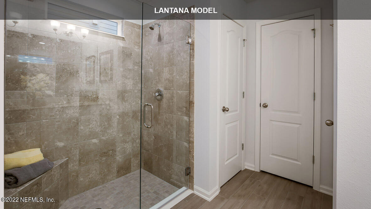 65838 Edgewater Drive Yulee, FL 32097 - Photo 9 of 44 a bathroom with a shower