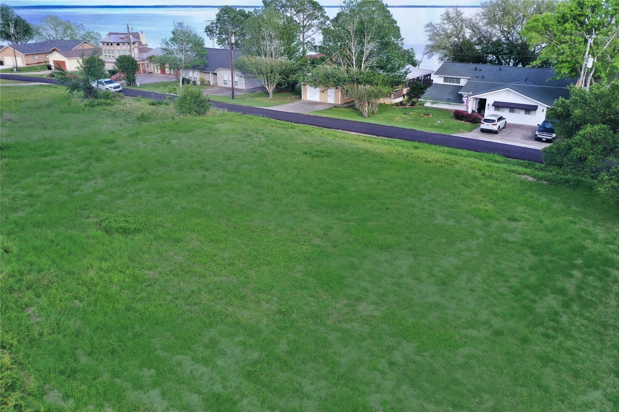 Lot 25-26 Lake Cir Point Point Blank, TX 77364 - Photo 3 of 6 an aerial view of a house with a yard