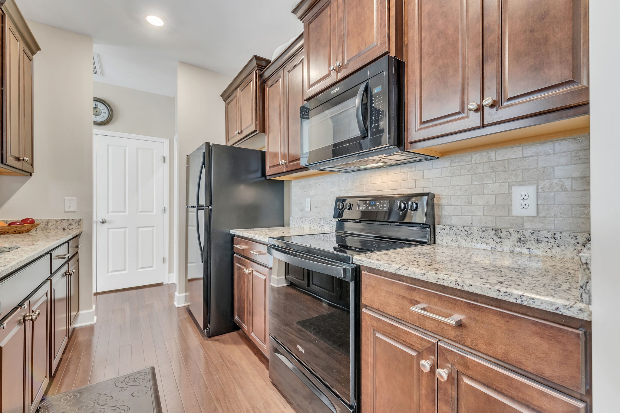 2218 Rigden Mill Drive Smyrna, TN 37167 - Photo 14 of 32 a kitchen with stainless steel appliances granite countertop a refrigerator stove and sink