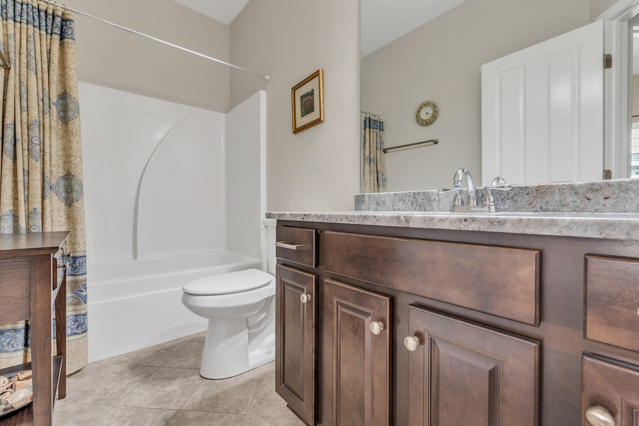 2218 Rigden Mill Drive Smyrna, TN 37167 - Photo 24 of 32 a bathroom with a granite countertop sink a toilet and a mirror