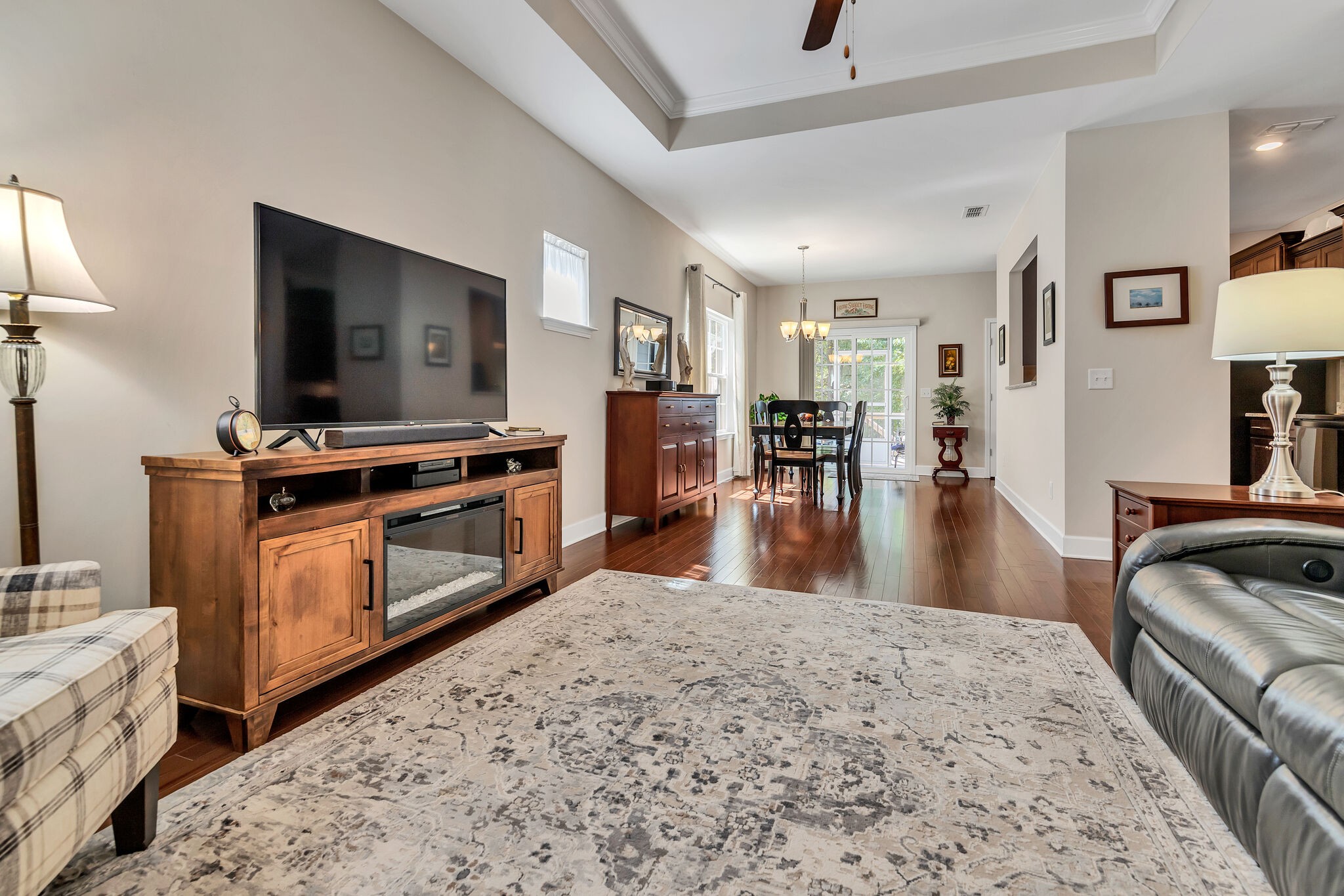 2218 Rigden Mill Drive Smyrna, TN 37167 - Photo 5 of 32 a living room with stainless steel appliances furniture a fireplace a flat screen tv and a kitchen view