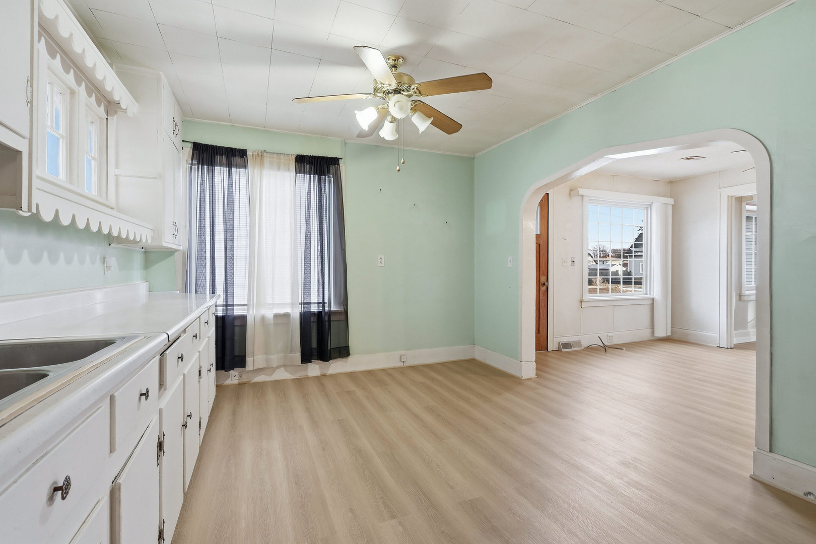2748 12th Avenue Moline, IL 61265 - Photo 3 of 35 wooden floor in an empty room with a kitchen