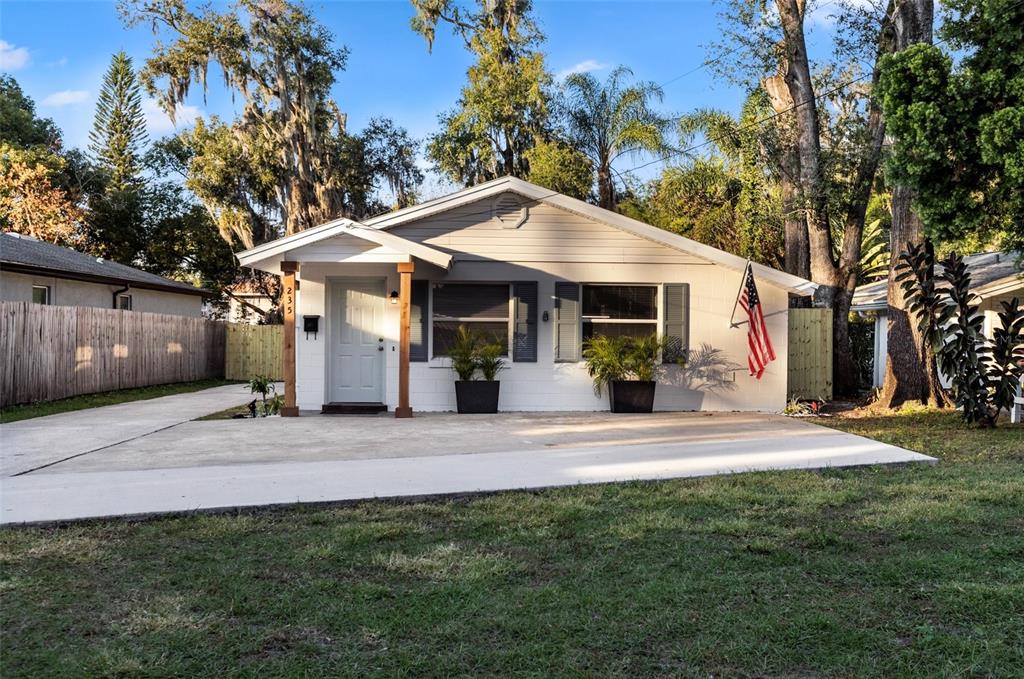 235 Emory Place Orlando, FL 32804 - Photo 1 of 1 a view of a house with a yard and tree s