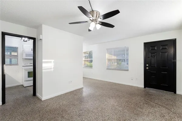 a view of an empty room with a cabinet
