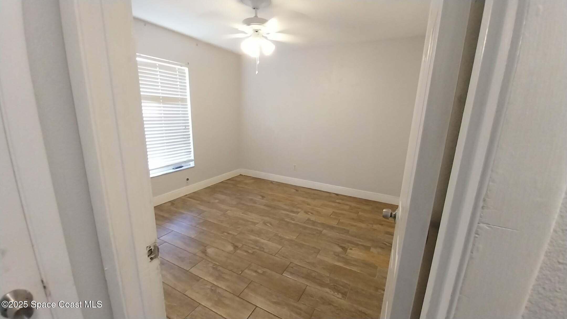 4180 Tom Court Mims, FL 32754 - Photo 8 of 10 a view of empty room with window