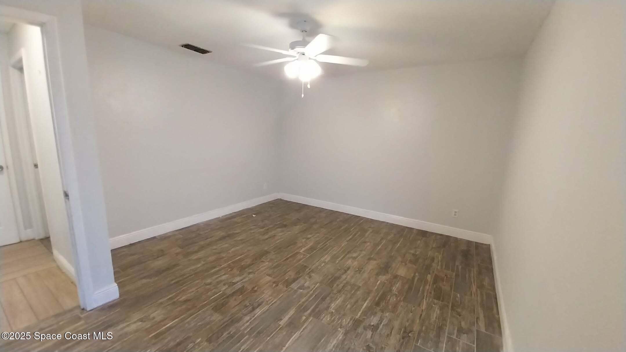 4180 Tom Court Mims, FL 32754 - Photo 9 of 10 wooden floor in an empty room