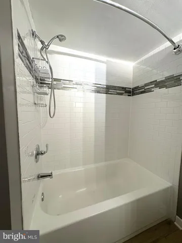 a close view of a bathtub in a bathroom