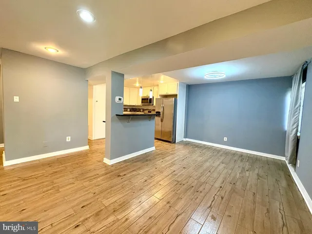 a view of a kitchen with a sink and a stove top oven