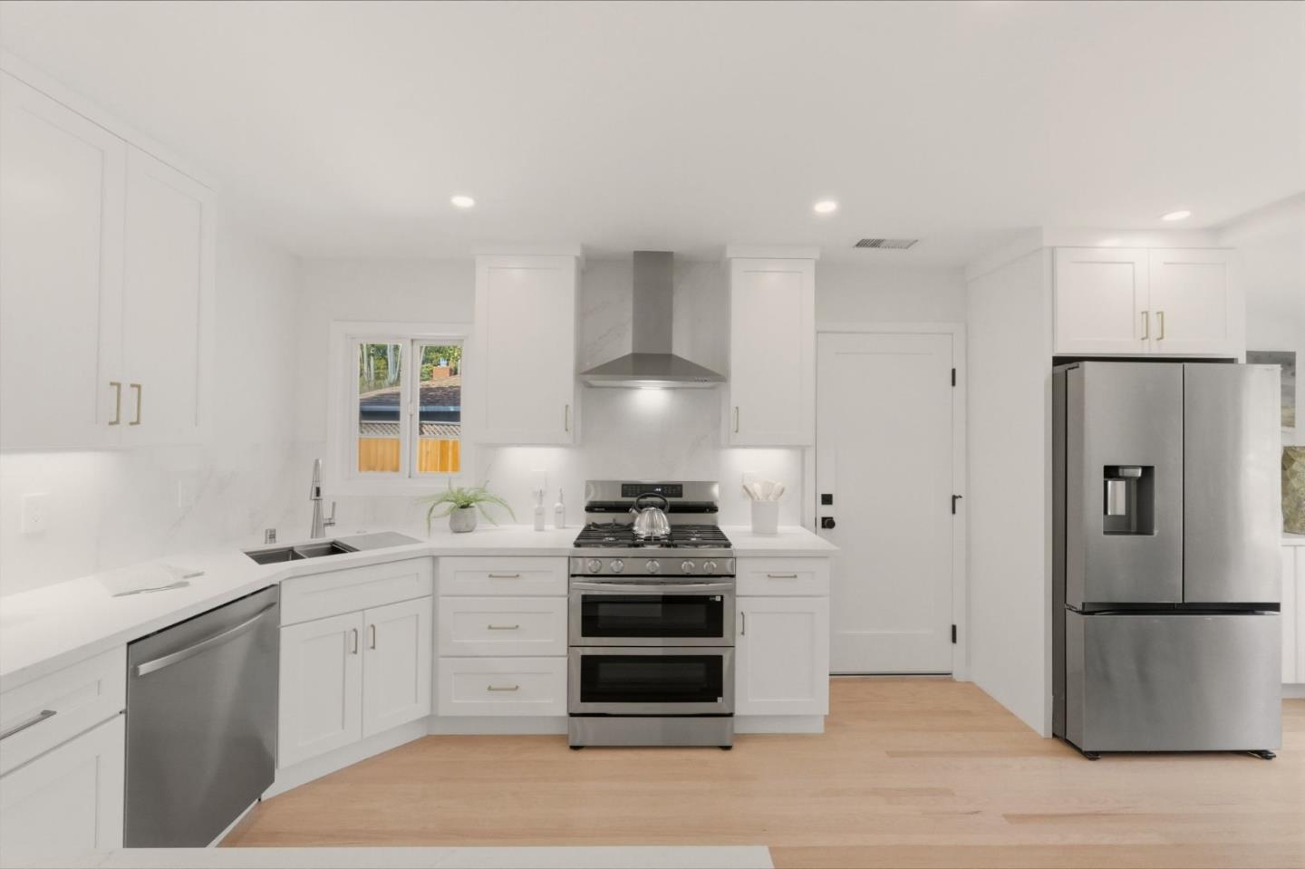 774 Ridge Rd. Santa Clara, CA 95051 - Photo 12 of 50 a kitchen with a stove a refrigerator and a sink
