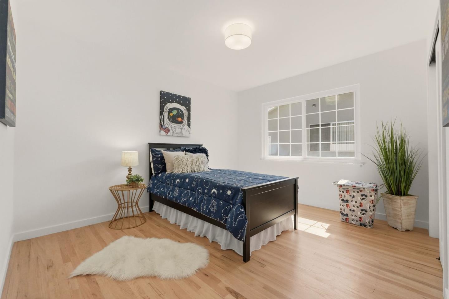 774 Ridge Rd. Santa Clara, CA 95051 - Photo 29 of 50 a bedroom with a bed and wooden floor